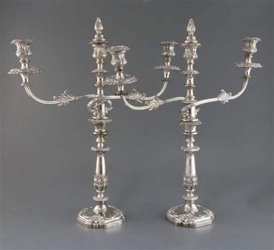 A pair of 19th century Sheffield plate two branch three light candelabra, 52.5cm.